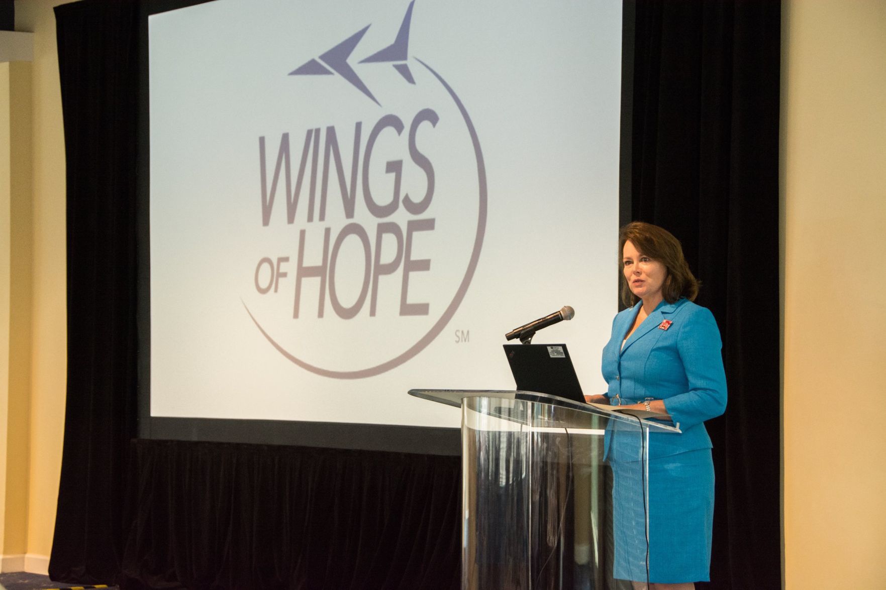 Laura Helling, Vice-President of Wings of Hope speaks to the guests in attendance